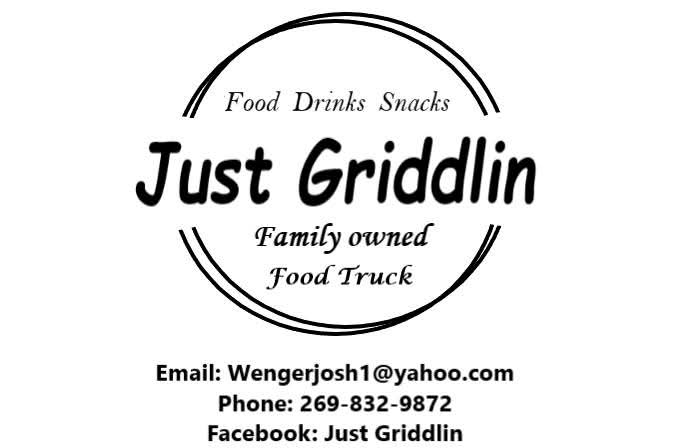 Josh with the Just Griddlin' sign